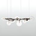 Modern clear glass globe chandelier with transparent spherical shades and bronze ring frame