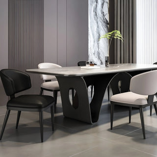 Modern dining room with luxury upholstered dining chairs around a marble table