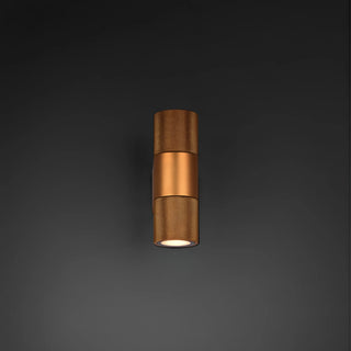 Gold LED industrial wall sconce glowing on dark background