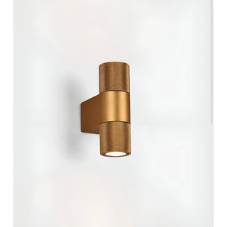 Front view of gold industrial wall sconce with sleek IP65 LED lighting