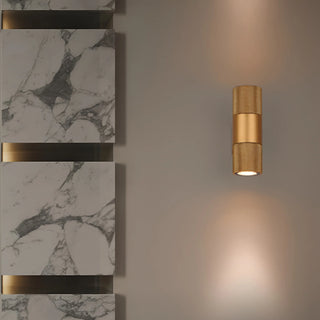 Modern industrial gold wall light illuminating luxury interior wall