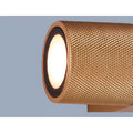 Close-up view of gold textured finish on modern industrial IP65 wall light