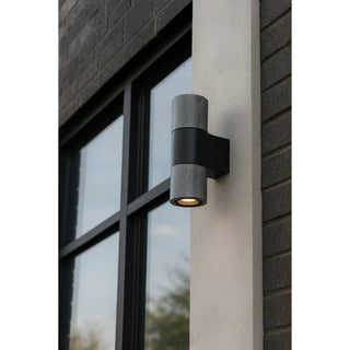 Modern silver wall light installed outdoors on contemporary building