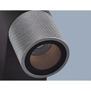 Close-up of silver industrial LED wall sconce with diamond textured finish