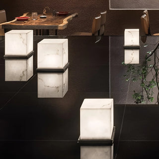 Modern restaurant décor featuring luminous marble cube lights — sophisticated indoor-outdoor design accent