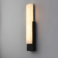 Front angle of the modern marble-look LED sconce in black finish with illuminated faux alabaster panel