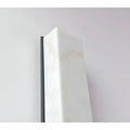 Close-up of the top faux alabaster shade on the LED sconce, revealing realistic marble-like veining