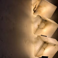 Close-up of natural marble texture with warm LED illumination