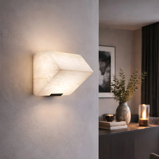Single marble wall sconce in modern living room with warm architectural lighting