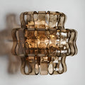 Front view of a smoked Murano glass wall light with sculptural textured glass and warm ambient illumination