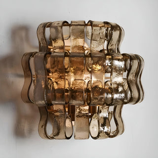 Front view of a smoked Murano glass wall light with sculptural textured glass and warm ambient illumination