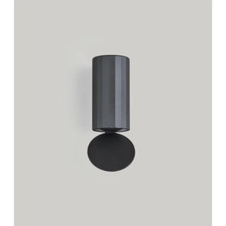Front view of the DAWN Series outdoor wall light in matte black with light reflection disc