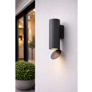 DAWN Series modern black outdoor wall light mounted on a white exterior wall near a window