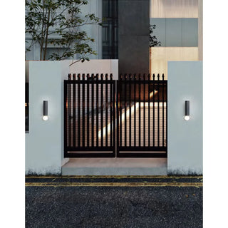 DAWN Series modern outdoor wall lights in black installed on residential exterior entrance gate