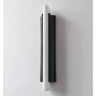 Front view of sand black modern outdoor wall light with curved resin design