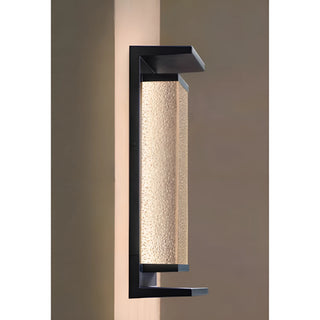 Modern outdoor wall sconce with textured glass and black aluminum frame