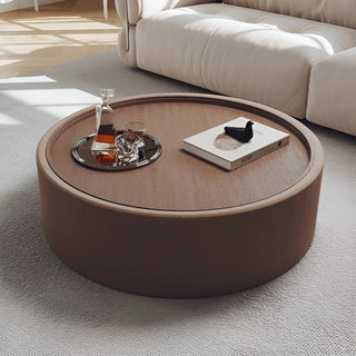 Brown round coffee table with solid walnut veneer top and eco-fabric finish
