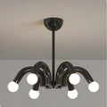 Modern sculptural chandelier in black finish with six curved arms and white globe bulbs, statement ceiling light