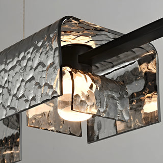 Side detail of modern copper chandelier showing layered textured glass and integrated LED bulb