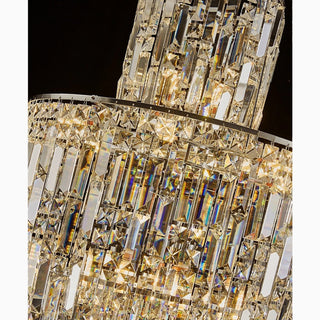 Close-up of Moneglia chandelier upper tier showing faceted crystals and metal frame