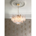 Elegant Murano glass chandelier suspended beneath a decorative ceiling medallion