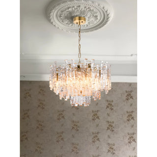 Elegant Murano glass chandelier suspended beneath a decorative ceiling medallion