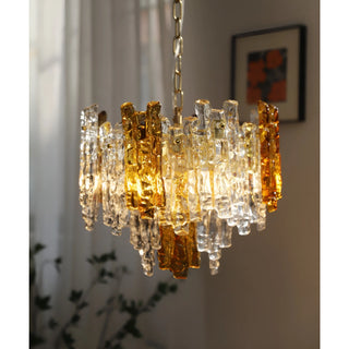 Elegant Murano glass chandelier with amber details near a softly lit window interior