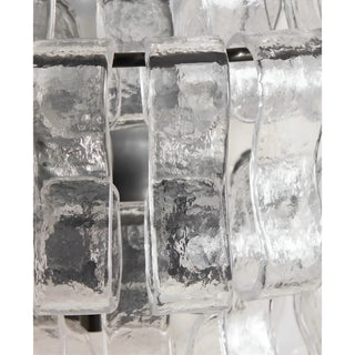 Close-up detail of clear Murano glass panels on a modern Italian wall sconce with textured handcrafted art glass