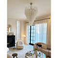 Murano-style tiered textured glass chandelier in a bright modern living room