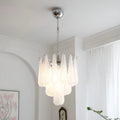 Murano-style tiered textured glass chandelier with chrome frame in a bright modern interior