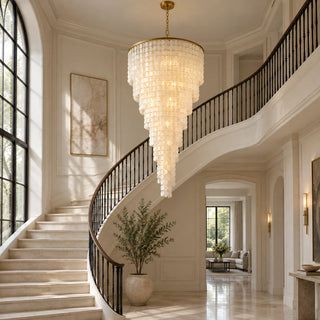 Nacara custom capiz shell spiral chandelier beside a curved staircase
