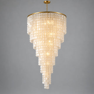 Nacara custom capiz shell spiral chandelier with gold spiral frame against a gray background