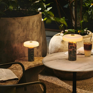 Two Nordic marble portable touch table lamps creating warm ambient lighting on marble table