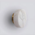 Close-up of luxury natural onyx wall sconce with gold base