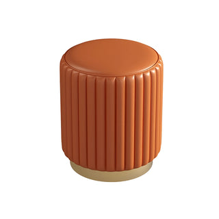 Orange leather vanity stool with ribbed detailing and matte gold base — statement accent chair