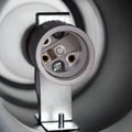 Close-up view of the E27 socket base inside the wall light fixture