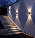 LED wall lights illuminating outdoor staircase area with warm dual-beam lighting