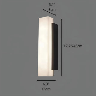 Vertical wall sconce light with matte black base and 45cm alabaster-style diffuser, warm glow