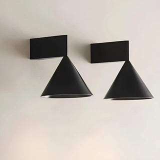 Pair of minimalist black Bauhaus cone wall lamps mounted symmetrically on white wall