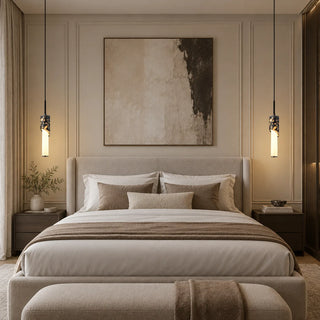 Pair of Pietrara marble cylinder pendant lights hanging as bedside lighting in a warm neutral bedroom