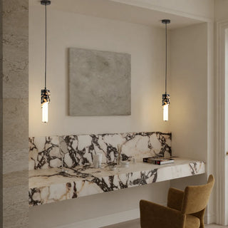 Pair of Pietrara marble pendant lights above a marble vanity in a luxury dressing area