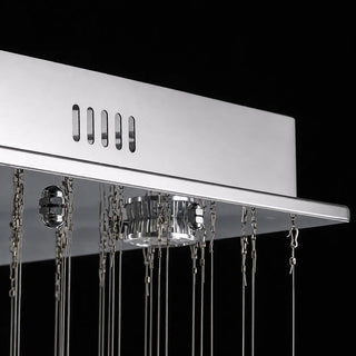 Detail of the polished chrome canopy, GU10 spotlights and steel cables of the Piovara chandelier