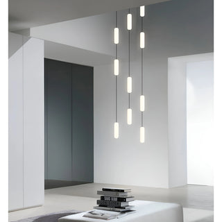 Pluvara capsule pendant cascade in a bright minimalist living space with white walls