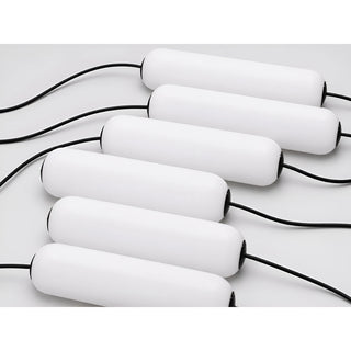Close-up of the Pluvara chandelier's frosted PMMA capsule pillars on slim black cables