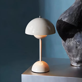 Modern white portable mushroom table lamp with rechargeable LED on designer table