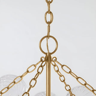 Detailed view of gold suspension chain and frame on rectangular modern glass chandelier