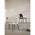 Nordic dining chairs in rice white and black in minimalist living room setting