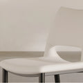 Close-up of rice white dining chair showing leather texture and stitching detail