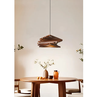 Roquesteron retro wooden LED pendant light hanging above a round wooden dining table in a cozy interior
