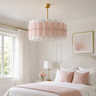Rosara blush and white Murano glass drum chandelier over the bed in a serene bedroom